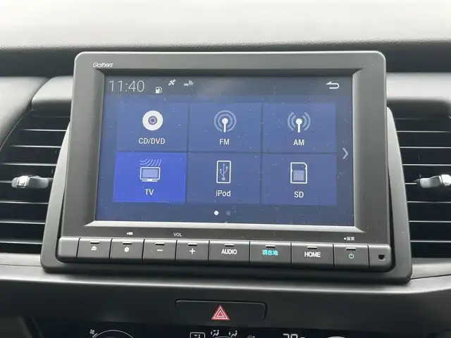ホンダ フィット e:HEVホーム 長崎県 2023(令5)年 0.1万km プラチナホワイトパール ワンオーナー/純正HDDナビ/(CD/DVD/BT/フルセグ)/バックカメラ/衝突軽減ブレーキ/レーンアシスト/コーナーセンサー/レーダークルーズ/ハーフレザーシート/ETC/オートライト/電子パーキングブレーキ/電動格納ミラー