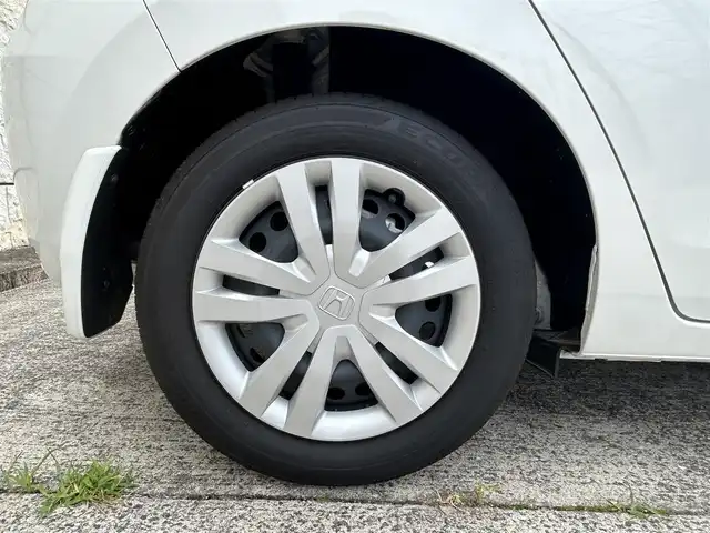 ホンダ フィット e:HEVホーム 長崎県 2023(令5)年 0.1万km プラチナホワイトパール ワンオーナー/純正HDDナビ/(CD/DVD/BT/フルセグ)/バックカメラ/衝突軽減ブレーキ/レーンアシスト/コーナーセンサー/レーダークルーズ/ハーフレザーシート/ETC/オートライト/電子パーキングブレーキ/電動格納ミラー