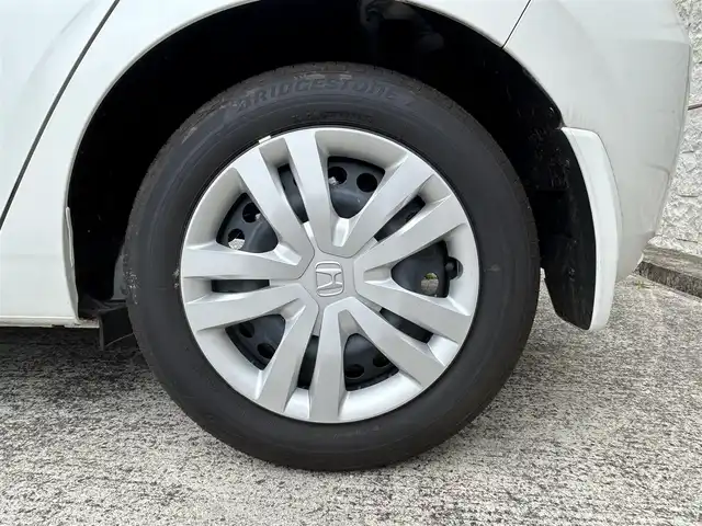 ホンダ フィット e:HEVホーム 長崎県 2023(令5)年 0.1万km プラチナホワイトパール ワンオーナー/純正HDDナビ/(CD/DVD/BT/フルセグ)/バックカメラ/衝突軽減ブレーキ/レーンアシスト/コーナーセンサー/レーダークルーズ/ハーフレザーシート/ETC/オートライト/電子パーキングブレーキ/電動格納ミラー