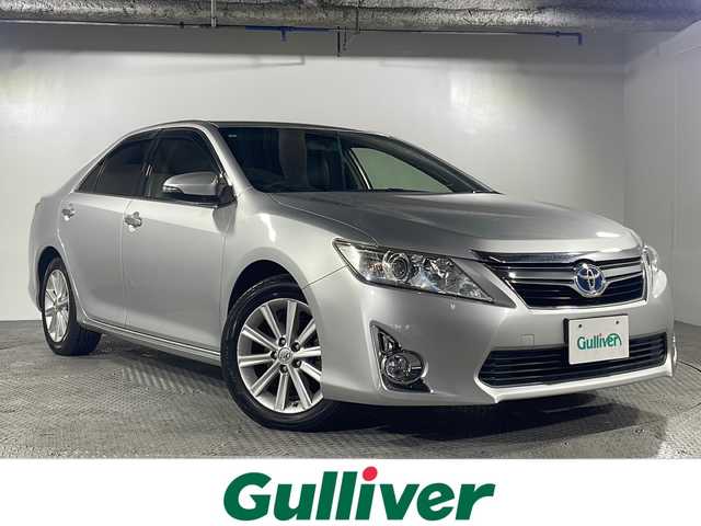 トヨタ カムリ ハイブリット レザーパッケージ 沖縄県 2013(平25)年 6.6万km シルバーM 禁煙車/純正ナビ/(BT/AM/FM/CD/DVD/ワンセグTV)/バックカメラ/ステアリングリモコン/ビルドインETC/クルーズコントロール/レザーシート/パワーシート/シートヒーター/取扱説明書/純正ドアバイザー/純正フロアマット