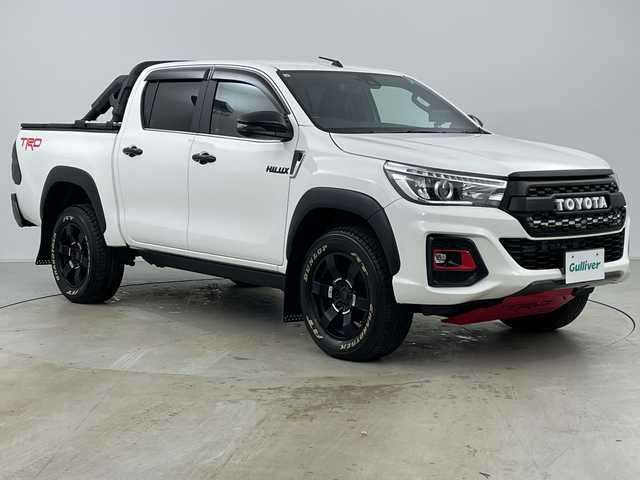 トヨタ ハイラックス Z ブラックラリーエディション 道央・札幌 2020(令2)年 1.9万km スーパーホワイトⅡ ・4WD/・寒冷地仕様/・社外ナビ（CN-RE05WD）/・BT&CD&DVD&フルセグTV/・バック、左サイド、フロントカメラ/・トヨタセーフティセンス/・レーンディパーチャーアラート/・アダプティブクルーズコントロール/・フロントワイパーデアイサー/・ドアミラーヒーター/・ダウンヒルアシストコントロール/・オートライト/・LEDヘッドライト/・社外LEDスモークテール/・TRDステッキガード/・TRDロールバー/・トノカバー/・社外電動格納サイドステップ/・リアステップ/・積込純正サイドステップ/・レザー調シートカバー