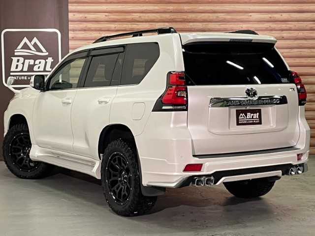 トヨタ ランドクルーザー プラド TX Lパッケージ 道北・旭川 2017(平29)年 2.5万km ホワイトパールクリスタルシャイン 【2405032058】/アルパイン9インチナビ（社外）/クルーズコントロール/前席シートヒーター/ベンチレーター/ETC/オートハイビーム/ヘッドライトウォッシャー/センターデフロック/コーナーセンサー/純正フロアマット/純正ドアバイザー/7人乗り/20AW ナイトロパワー  H6スラッグ（社外）/レーダー　レネゲードR/T＋（社外）/ボンネットエンブレム/社外パーツ取り付けあり。