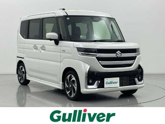 スズキ スペーシア カスタム HYBRID XS ターボ 熊本県 2024(令6)年 1.2万km ピュアホワイトP 禁煙車　/純正ナビ（ＡｐｐｌＣａｒＰｌａｙ・ＡｎｄｒｏｉｄＡｕｔｏ・ＢＴ・フルセグ）/全周囲カメラ　/両側パワースライドドア　/前後クリアランスソナー　/前席シートヒーター　/ステアリングヒーター/スズキセーフティサポート/・デュアルセンサーブレーキサポート/・誤発進制御機能/・後方誤発進抑制/・車線逸脱警報/・車線逸脱抑制機能/・ふらつき警報機能/・発進お知らせ機能/・標識認識機能/・アダブティブクルーズコントロール/横滑り防止/アイドリングストップ/ヘッドアップディスプレイ/純正フロアマット/純正１５インチAW/オートライト/LEDヘッドライト/フォグライト/スマートキー/プッシュスタート/スペアキー1本/保証書/取扱説明書