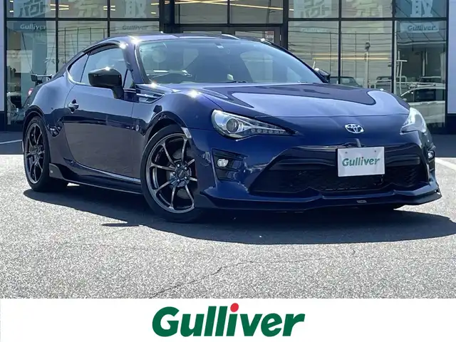 トヨタ ８６ GT リミテッド ブラックPKG 岡山県 2018(平30)年 8.7万km アズライトブルー 登録時走行距離86635km/社外ナビ（AM/FM/CD/DVD/BT）/バックカメラ/RAYS18インチアルミホイール/BLITZマフラー/TOM’Sエアロパーツ/純正bremboレッドキャリパー/アルカンターラシート/クルーズコントロール/LEDヘッドライト/LEDフォグランプ/スマートキー/プッシュスタート/シートヒーター/電格ミラー