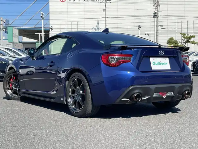 トヨタ ８６ GT リミテッド ブラックPKG 岡山県 2018(平30)年 8.7万km アズライトブルー 登録時走行距離86635km/社外ナビ（AM/FM/CD/DVD/BT）/バックカメラ/RAYS18インチアルミホイール/BLITZマフラー/TOM’Sエアロパーツ/純正bremboレッドキャリパー/アルカンターラシート/クルーズコントロール/LEDヘッドライト/LEDフォグランプ/スマートキー/プッシュスタート/シートヒーター/電格ミラー