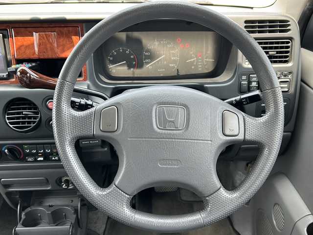 ホンダ ステップワゴン G 愛知県 1998(平10)年 14.1万km ニューボーグシルバーメタリック /禁煙ワンオーナー//純正エアロ(フロント/サイド/リア)//モデューロ15インチアルミ//Wサンルーフ//社外HDDナビ(パナソニック　CN-HW850D)//フルセグTV/HDD/CD/DVD/AM/FM//ETC//純正キーレスエントリーシステム//スペアキー//純正フロアマット//ワイドドアバイザー//電動格納ミラー//シガーライター//WAC//スライドドア//後席カーテン//3列シート//保証書//取扱説明書