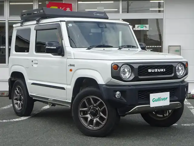 スズキ ジムニー XC 静岡県 2021(令3)年 4.8万km ピュアホワイトP ワンオーナー/禁煙車/クルーズコントロール/純正ラバーマット/ルーフキャリア/前席シートヒーター/KENWOOD CDオーディオ/ステアリングリモコン/セーフティサポート/・デュアルセンサーブレーキサポート/・誤発進抑制機能/・車線逸脱警報機能/・ふらつき警報機能/・先行車発進お知らせ機能/・標識認識機能/・ハイビームアシスト/LEDヘッドライト/オートライト/プッシュスタート・スマートキー/保証書・取扱説明書