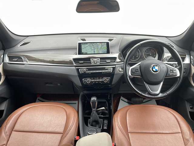 ＢＭＷ Ｘ１ xDrive 20i 山形県 2015(平27)年 5.6万km 茶 禁煙車/４WD/純正ナビ（CD.DVD.Bluetooth.AUX）/バックカメラ/アイドリングストップ/ヒートシーター/サンルーフ/スマートキー/横滑り防止装置/コーナーセンサー/ABS/エアバッグWサイド