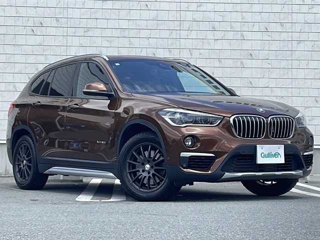 ＢＭＷ Ｘ１ xDrive 20i 山形県 2015(平27)年 5.6万km 茶 禁煙車/４WD/純正ナビ（CD.DVD.Bluetooth.AUX）/バックカメラ/アイドリングストップ/ヒートシーター/サンルーフ/スマートキー/横滑り防止装置/コーナーセンサー/ABS/エアバッグWサイド