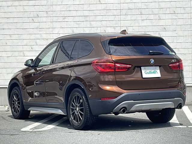 ＢＭＷ Ｘ１ xDrive 20i 山形県 2015(平27)年 5.6万km 茶 禁煙車/４WD/純正ナビ（CD.DVD.Bluetooth.AUX）/バックカメラ/アイドリングストップ/ヒートシーター/サンルーフ/スマートキー/横滑り防止装置/コーナーセンサー/ABS/エアバッグWサイド