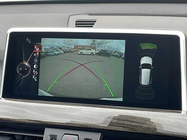 ＢＭＷ Ｘ１ xDrive 20i 山形県 2015(平27)年 5.6万km 茶 禁煙車/４WD/純正ナビ（CD.DVD.Bluetooth.AUX）/バックカメラ/アイドリングストップ/ヒートシーター/サンルーフ/スマートキー/横滑り防止装置/コーナーセンサー/ABS/エアバッグWサイド