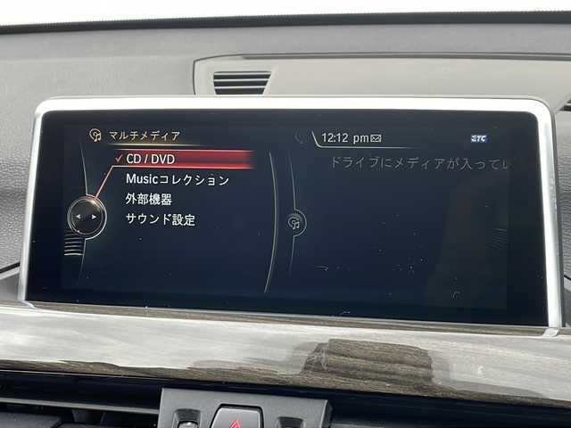 ＢＭＷ Ｘ１ xDrive 20i 山形県 2015(平27)年 5.6万km 茶 禁煙車/４WD/純正ナビ（CD.DVD.Bluetooth.AUX）/バックカメラ/アイドリングストップ/ヒートシーター/サンルーフ/スマートキー/横滑り防止装置/コーナーセンサー/ABS/エアバッグWサイド