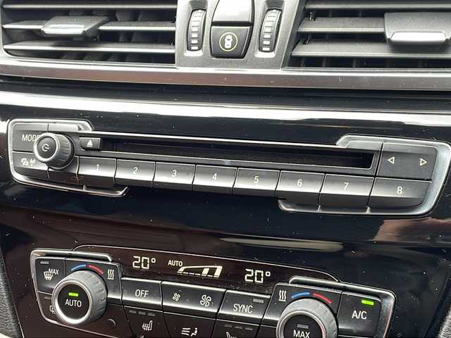 ＢＭＷ Ｘ１ xDrive 20i 山形県 2015(平27)年 5.6万km 茶 禁煙車/４WD/純正ナビ（CD.DVD.Bluetooth.AUX）/バックカメラ/アイドリングストップ/ヒートシーター/サンルーフ/スマートキー/横滑り防止装置/コーナーセンサー/ABS/エアバッグWサイド