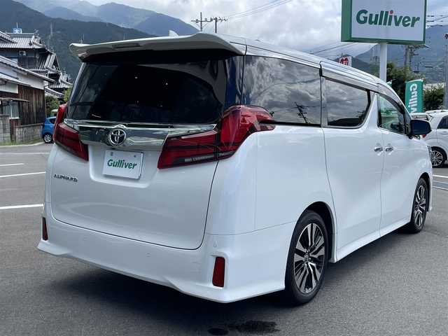 トヨタ アルファード S Cパッケージ 愛媛県 2021(令3)年 7.3万km ホワイトパールクリスタルシャイン プリクラッシュセーフティ/レーダークルーズコントロール/レーントレーシングアシスト/クリアランスソナー /ロードサインアシスト/PKSB/Wサンルーフ/純正8インチディスプレイオーディオ/　CD/DVD/Bluetooth/フルセグTV/フリップダウンモニター/バックカメラ/ビルトインETC/黒革シート/前席パワーシート/シートヒーター/シートベンチレーション/パワーバックドア/両側パワースライドドア/パワーバックドア/プッシュスタート/オートライト/三眼LEDヘッドライト/フロアマット
