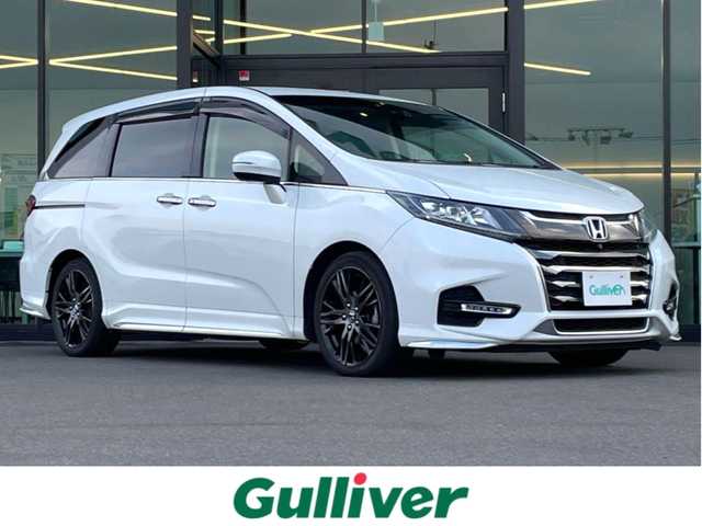 ホンダ オデッセイ アブソルート・EXホンダセンジング 東京都 2018(平30)年 6.4万km プラチナホワイトパール 純正９インチナビ/後席１１．６インチフリップダウンモニター/全周囲カメラ/スマートパーキングアシスト/両側パワースライド/ホンダセンシング/・衝突軽減ブレーキ/・アダプティブクルーズコントロール/・車線維持支援システム/・誤発進抑制機能/ブラインドスポットモニター/ビルトインＥＴＣ２．０/ハーフレザーシート/パドルシフト/前後ドライブレコーダー/360°ドライブレコーダー/純正18インチAW/純正フロアマット/スマートキー×2/保証書/取扱説明書