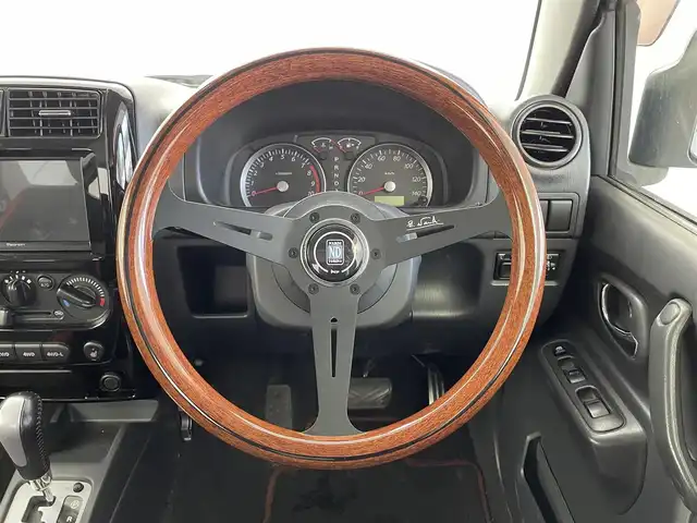 スズキ ジムニー クロスアドベンチャー 福井県 2014(平26)年 11.4万km ブルーイッシュブラックパール3 ディスプレイオーディオ/（AndroidAuto/CarPlay/Bluetooth/ラジオ）/社外ステアリング（NARDI）/シートヒーター/レザーシート/フォグランプ/ヘッドライトレベライザー/４WD/ETC/電格ミラー/AC/パワーウインドウ/ドアバイザー