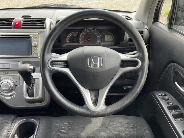 ホンダ ゼスト スパーク Wターボ 新潟県 2009(平21)年 11万km クエーサーグレーパール 純正ナビCD/DVD/HIDヘッドライト/4WD/純正フロアマット/純正14インチアルミホイール/ETC/スマートキー