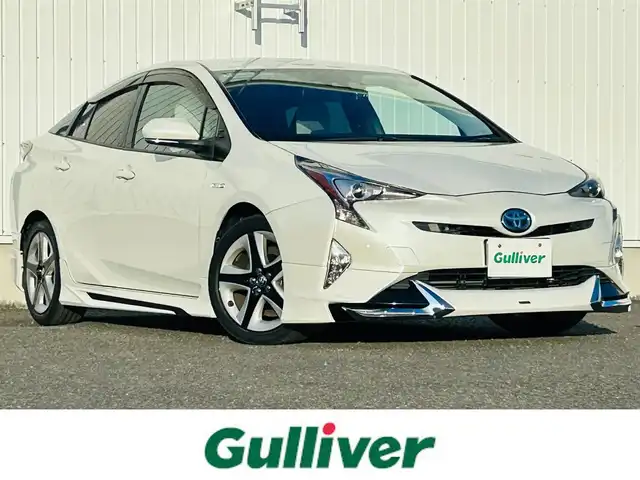 トヨタ プリウス A プレミアム　ツーリングセレ 熊本県 2016(平28)年 7.8万km ホワイトパールクリスタルシャイン 純正ナビ/・AM/FM/CD/DVD/BT/SD/・フルセグTV/・バックカメラ/モデリスタエアロ（F.S.R）/トヨタセーフティセンス/・プリクラッシュセーフティ/・レーンディパーチャーアラート/・ブラインドスポットモニター/・レーダークルーズコントロール/・クリアランスソナー/・ふらつき警報/・ヘッドアップディスプレイ/・オートハイビーム/・パーキングアシスト/革シート/前席パワーシート/前席シートヒーター/ETC/革巻きステアリング/ステアリングスイッチ/LEDヘッドライト/フォグランプ/純正アルミホイール/純正フロアマット/ドアバイザー/電動格納ミラー/ウインカーミラー/スペアキー