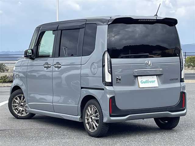 ホンダ Ｎ ＢＯＸ カスタム ターボ コーディネートS 島根県 2023(令5)年 2.4万km グレー 登録時走行距離　23257km/ワンオーナー/保証書/取扱説明書/Honda SENSING/純正ナビ/（Bluetooth/AM/FM/USB/typeC/CD/DVD)/AppleCarPlay/Android Auto/フルセグテレビ/バックカメラ/追従型クルーズコントロール/レーンキープアシスト/両側パワースライドドア/ブレーキホールド/オートリトラミラー/シートヒーター（DN席）/グレーステッチ 本革巻ステアリングホイール/パドルシフト/踏み間違い衝突軽減システム/ETC2.0/ドライブレコーダー前後/カラーコード　NH-912PA