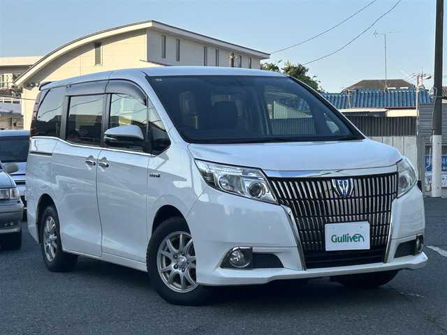 トヨタ エスクァイア ハイブリッド Gi 東京都 2015(平27)年 7.4万km ホワイトパールクリスタルシャイン ワンオーナー/メモリー純正ナビ/AM/FM/ワンセグ/BT/『NSCP-W64』/バックカメラ/セーフティセンスC/・プリクラッシュセーフティシステム/・レーンディパーチャーアラート/・オートマチックハイビーム/クルーズコントロール/置くだけ充電/両側パワースライドドア/DN席シートヒーター/ハンドル革巻きステアリング/ETC/スペアキー×1/合皮シート/保証書/取扱説明書