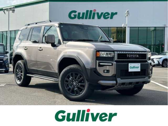 トヨタ ランドクルーザー ２５０ VX 愛媛県 2024(令6)年 0.5万km アバンギャルドブロンズメタリック トヨタセーフティセンス/純正ナビ（FM/AM/フルセグTV/Bluetooth）/バックカメラ/ETC2.0/クルーズコントロール/アイドリングストップ/サンルーフ/パワーバックドア/パワーシート/シートヒーター/横滑り防止装置/コーナーセンサー/レーンキープアシスト/オートライト/オートマチックハイビーム