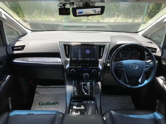 トヨタ アルファード S Cパッケージ 富山県 2018(平30)年 6.3万km ダークレッドマイカメタリック 純正10型ナビ(BT/CD/DVD)/フルセグTV/パワースライドドア(両側)/パワーバックドア/バックカメラ/ビルトインETC/コムテックドライブレコーダー/純正12.1型後席ディスプレイ/レーダークルーズコントロール/インテリジェントクリアランスソナー/セーフティセンス/・プリクラッシュセーフティ/・レーントレーシングアシスト/・ロードサインアシスト/・アダプティブハイビームシステム/ブラインドスポットモニター/デジタルインナーミラー/純正3眼LEDヘッドランプ/デュアルオートエアコン/木目調/革巻きコンビステアリング/ステアリングヒーター/ブラック合皮シート/前列パワーシート/快適温熱シート/2列目エグゼクティブパワーシート/助手席パワーオットマン/運転席ポジションメモリー/モデリスタエアロ(F/S/R)/純正18インチアルミホイール/スマートエントリー/プッシュスタートシステム/ウェルカムパワースライドドア機能/禁煙車
