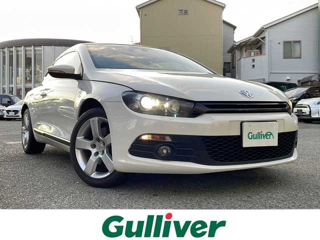 フォルクスワーゲン シロッコ TSI 大阪府 2011(平23)年 10.9万km パール 社外ナビ/CD/DVD/フルセグテレビ/バックカメラ/ハーフレザーシート/革巻きステアリング/OETTINGERアルミホイール/オートライト/フォグランプ/フロアマット/ETC/ウインカーミラー/スペアキー