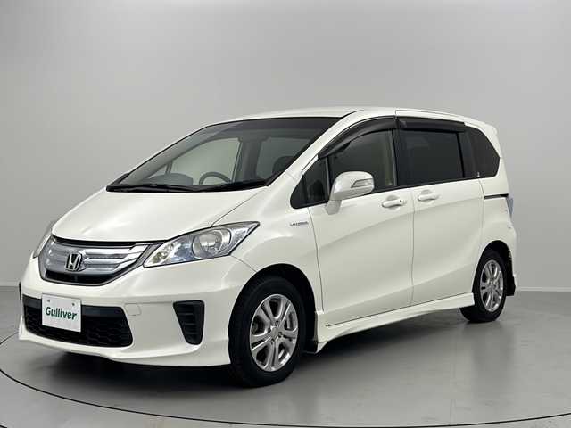 ホンダ フリード ハイブリット ジャストセレクション 福島県 2012(平24)年 7.1万km プレミアムホワイトパール /社外SDナビ//Bluetooth//フルセグテレビ//クルーズコントロール(追従無)//横滑り防止装置//盗難防止装置//ホイール付スタットレスタイヤ積載//社外アルミホイール//ETC//オートライト//アイドリングストップ//スペアキー