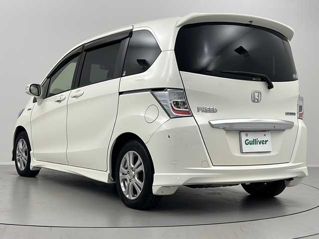 ホンダ フリード ハイブリット ジャストセレクション 福島県 2012(平24)年 7.1万km プレミアムホワイトパール /社外SDナビ//Bluetooth//フルセグテレビ//クルーズコントロール(追従無)//横滑り防止装置//盗難防止装置//ホイール付スタットレスタイヤ積載//社外アルミホイール//ETC//オートライト//アイドリングストップ//スペアキー