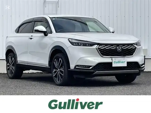 ホンダ ヴェゼル ハイブリッド e:HEV Z 熊本県 2022(令4)年 3万km パール 純正ナビ　BT/USB/AM/FM/フルセグTV/バックカメラ/ホンダセンシング/パワーテールゲート/オートクルーズコントロール/本革巻きステアリング/・ステアリングヒーター/・ステアリングリモコン/・パドルシフト/ビルトインETC2.0/電子パーキング/・オートブレーキホールド/ハーフレザーシート/・D/Nシートヒーター/LEDヘッドライト/・オートライト/プッシュスタート/・スマートキー/・スペアキー×１/ウインカーミラー/・電動格納ミラー