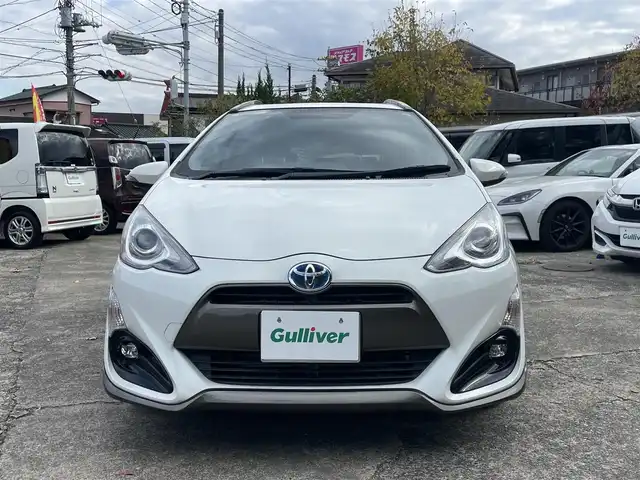 トヨタ アクア X－URBAN 千葉県 2015(平27)年 9.7万km ライムホワイトパールクリスタルシャイン カーオーディオ/・ラジオ/CD/AUX/USB/リアルーフスポイラー/ETC/横滑り制御機能(VSC)/タイヤ空転抑制機能(TRC)/電子制御ブレーキシステム/ヒルスタートアシストコントロール/車両接近通報装置/緊急ブレーキシグナル/ハーフレザーシート/純正16インチアルミホイール/取扱説明書/保証書/スペアキー