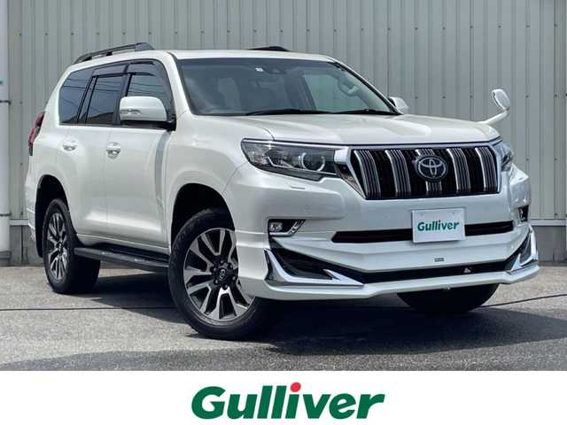 トヨタ ランドクルーザー プラド TX Lパッケージ 山形県 2022(令4)年 3.1万km ホワイトパールクリスタルシャイン MODELLISTAエアロ/7人乗り/4WD/セーフティセンス/サンルーフ/純正ナビ/　【CD SD BT】/ワンセグTV/バックカメラ/ステアリングスイッチ/レーダークルーズコントロール/レザーシート/シートヒーター/エアシート/横滑り防止装置/コーナーセンサー/LEDライト/フォグランプ/ウィンカーミラー/純正フロアマット/ドアバイザー/純正19インチAW