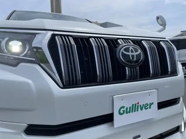 トヨタ ランドクルーザー プラド TX Lパッケージ 山形県 2022(令4)年 3.1万km ホワイトパールクリスタルシャイン MODELLISTAエアロ/7人乗り/4WD/セーフティセンス/サンルーフ/純正ナビ/　【CD SD BT】/ワンセグTV/バックカメラ/ステアリングスイッチ/レーダークルーズコントロール/レザーシート/シートヒーター/エアシート/横滑り防止装置/コーナーセンサー/LEDライト/フォグランプ/ウィンカーミラー/純正フロアマット/ドアバイザー/純正19インチAW