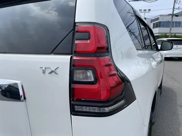 トヨタ ランドクルーザー プラド TX Lパッケージ 山形県 2022(令4)年 3.1万km ホワイトパールクリスタルシャイン MODELLISTAエアロ/7人乗り/4WD/セーフティセンス/サンルーフ/純正ナビ/　【CD SD BT】/ワンセグTV/バックカメラ/ステアリングスイッチ/レーダークルーズコントロール/レザーシート/シートヒーター/エアシート/横滑り防止装置/コーナーセンサー/LEDライト/フォグランプ/ウィンカーミラー/純正フロアマット/ドアバイザー/純正19インチAW