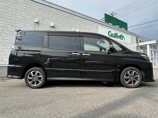 トヨタ ヴォクシー ZS 煌 山形県 2018(平30)年 12.2万km イナズマスパーキングブラックガラスフレーク 4WD/純正SDナビ/・Bluetooth/・フルセグテレビ/両側パワースライドドア/バックカメラ/デュアルエアコン/純正アルミホイール/クルーズコントロール/ETC2.0/アイドリングストップ/横滑り防止装置/レーンキープアシスト/オートライト/ハイビーム/盗難防止装置/衝突被害軽減システム