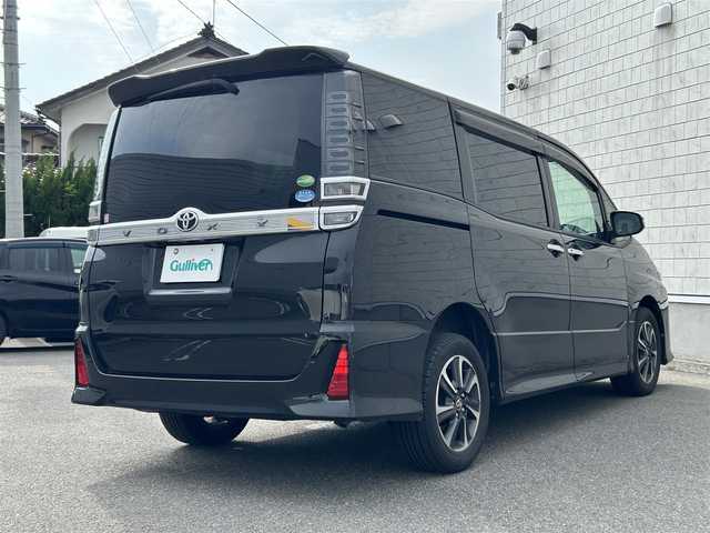 トヨタ ヴォクシー ZS 煌 山形県 2018(平30)年 12.2万km イナズマスパーキングブラックガラスフレーク 4WD/純正SDナビ/・Bluetooth/・フルセグテレビ/両側パワースライドドア/バックカメラ/デュアルエアコン/純正アルミホイール/クルーズコントロール/ETC2.0/アイドリングストップ/横滑り防止装置/レーンキープアシスト/オートライト/ハイビーム/盗難防止装置/衝突被害軽減システム