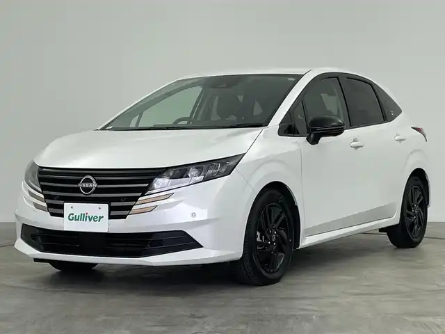 日産 ノート X 90周年記念車 群馬県 2024(令6)年 0.9万km ピュアホワイトパール 禁煙車　純正ナビ　Bluetooth　フルセグ　全方位カメラ　ブラインドスポットモニター　衝突軽減システム　オートマチックハイビーム　コーナーセンサー　LED　プッシュスタート　スマートキー