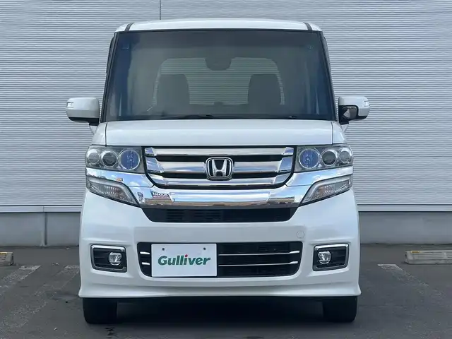 ホンダ Ｎ ＢＯＸ カスタム G ターボ Lパッケージ 秋田県 2017(平29)年 12.7万km プレミアムホワイトパールⅡ 社外ナビ/４WD/スマートキー/両側パワスラ/ターボ/フルセグ/前席シートヒーター/社外アルミ/社外フロアマット/ETC/ステアリングスイッチ/フリップダウンモニター/アイドリングストップ/プッシュスタート/オートライト/オートエアコン/パドルシフト/横滑り防止/純正ドアバイザー/オートエアコン/オートライト/パワーステアリング/パワーウィンドウ/電動格納ウィンカーミラー/フルフラットシート/チップアップシート/保証書/取扱説明書/記録簿