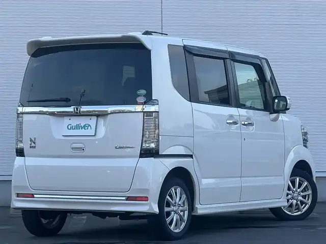 ホンダ Ｎ ＢＯＸ カスタム G ターボ Lパッケージ 秋田県 2017(平29)年 12.7万km プレミアムホワイトパールⅡ 社外ナビ/４WD/スマートキー/両側パワスラ/ターボ/フルセグ/前席シートヒーター/社外アルミ/社外フロアマット/ETC/ステアリングスイッチ/フリップダウンモニター/アイドリングストップ/プッシュスタート/オートライト/オートエアコン/パドルシフト/横滑り防止/純正ドアバイザー/オートエアコン/オートライト/パワーステアリング/パワーウィンドウ/電動格納ウィンカーミラー/フルフラットシート/チップアップシート/保証書/取扱説明書/記録簿