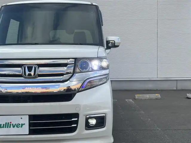 ホンダ Ｎ ＢＯＸ カスタム G ターボ Lパッケージ 秋田県 2017(平29)年 12.7万km プレミアムホワイトパールⅡ 社外ナビ/４WD/スマートキー/両側パワスラ/ターボ/フルセグ/前席シートヒーター/社外アルミ/社外フロアマット/ETC/ステアリングスイッチ/フリップダウンモニター/アイドリングストップ/プッシュスタート/オートライト/オートエアコン/パドルシフト/横滑り防止/純正ドアバイザー/オートエアコン/オートライト/パワーステアリング/パワーウィンドウ/電動格納ウィンカーミラー/フルフラットシート/チップアップシート/保証書/取扱説明書/記録簿