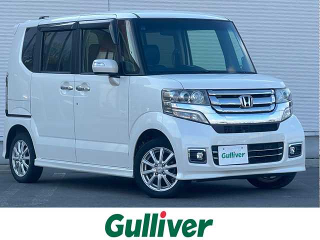 ホンダ Ｎ ＢＯＸ カスタム G ターボ Lパッケージ 秋田県 2017(平29)年 12.7万km プレミアムホワイトパールⅡ 社外ナビ/４WD/スマートキー/両側パワスラ/ターボ/フルセグ/前席シートヒーター/社外アルミ/社外フロアマット/ETC/ステアリングスイッチ/フリップダウンモニター/アイドリングストップ/プッシュスタート/オートライト/オートエアコン/パドルシフト/横滑り防止/純正ドアバイザー/オートエアコン/オートライト/パワーステアリング/パワーウィンドウ/電動格納ウィンカーミラー/フルフラットシート/チップアップシート/保証書/取扱説明書/記録簿