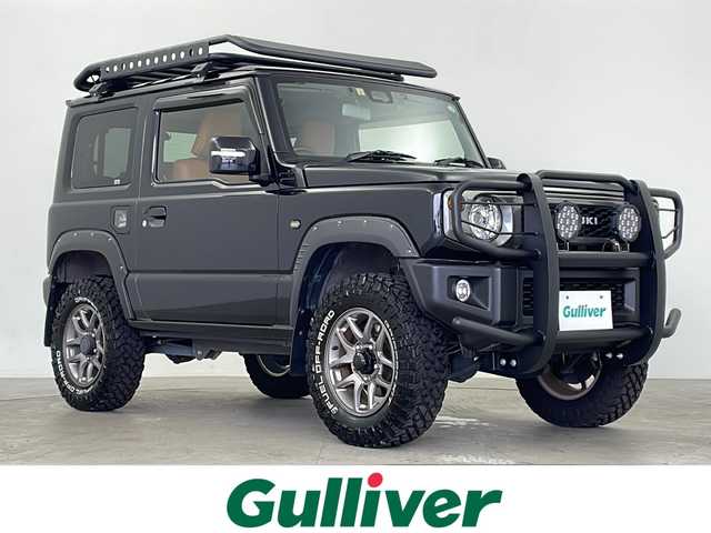 スズキ ジムニー XC 鹿児島県 2022(令4)年 2.4万km ブルーイッシュブラックパール3 GIGEAR1.5リフトアップ/GIGEARルーフラック＆リアラダー/社外9インチナビ/（AM/FM/CD/DVD/Bluetooth）/SUZUKIグリル/オレンジ革調キルティングシートカバー/クルーズコントロール/ドライブレコーダー/純正フロアマット/シートヒーターD/N席/純正ホイール/背面タイヤ/ABS/レーンキープアシスト/ダウンヒルアシスト/LEDヘッドライト/オートライト/ヘッドライトウォッシャー/アイドリングストップ/横滑り防止装置/盗難防止装置/衝突被害軽減システム/プッシュスタート/スマートキー/４WD