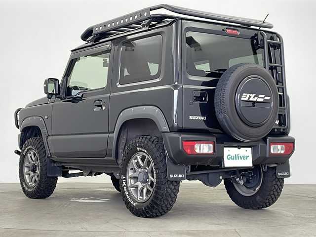 スズキ ジムニー XC 鹿児島県 2022(令4)年 2.4万km ブルーイッシュブラックパール3 GIGEAR1.5リフトアップ/GIGEARルーフラック＆リアラダー/社外9インチナビ/（AM/FM/CD/DVD/Bluetooth）/SUZUKIグリル/オレンジ革調キルティングシートカバー/クルーズコントロール/ドライブレコーダー/純正フロアマット/シートヒーターD/N席/純正ホイール/背面タイヤ/ABS/レーンキープアシスト/ダウンヒルアシスト/LEDヘッドライト/オートライト/ヘッドライトウォッシャー/アイドリングストップ/横滑り防止装置/盗難防止装置/衝突被害軽減システム/プッシュスタート/スマートキー/４WD