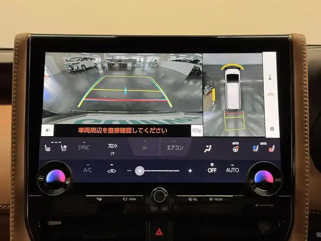 トヨタ ヴェルファイア ハイブリット Z プレミア 三重県 2024(令6)年 0.7万km ブラック ハイブリッド/FF/MTモード付フロアCVT/14型ナビ/（FM/AM/TV/Bluetooth/USB/iPod/Miracast/CarPlay/AndroidAuto）/13.2型 有機EL後席モニター V13T-R72F/パノラミックビューモニター（床下透過機能付）/モデリスタエアロ（F/S/R下）、シグネチャーイルミブレード/両側パワースライドドア/ドラレコ前後/ETC2.0/Toyota Safety Sense/●PCS、LTA、レーダークルコン、アダプティブハイビーム、RSA、PDA、緊急操舵支援＋前後クロストラフィックアラート*/●パーキングサポートブレーキ/・BSM/LCA/安心降車アシスト/・Advanced Drive/アドバンスト・パーク　など/装備/・【OP】デジタルインナーミラー/・【OP】ユニバーサルステップ（両側）/・左右独立ムーンルーフ/・プレミアムナッパ本革シート（茶）/・シートヒーター＆ベンチレーション（D/N/2nd）/・ステアリングヒーター/・パワーシート（Dメモリー付8way/N4way/2ndリクライニング＆オットマン）/・パワーバックドア/・HUD/・100Vコンセント（1500W）/・タッチトレーサーオペレーション/・3眼LEDヘッドランプ/・おくだけ充電/・19inAW/・保/・スマートキーx2/など