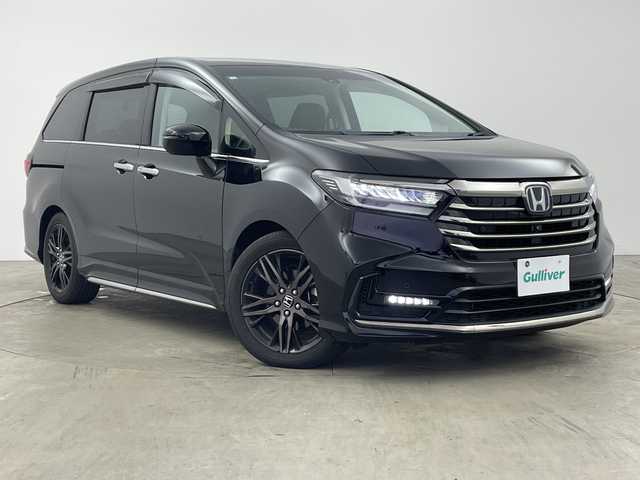 ホンダ オデッセイ ハイブリッド e:HEVアブソルート EX 兵庫県 2020(令2)年 4.7万km プレミアムスパークルブラックパール ・純正ナビ/・Bluetooth/CD/DVD/USB/TV/SD/HDMI/Apple car play/・全方位カメラ/・Honda SENSING/・衝突軽減ブレーキ（CMBS）、/・誤発進抑制機能/・後方誤発進抑制機能、歩行者/・事故低減ステアリング/・路外逸脱抑制機能/・渋滞追従機能付アダプティブクルーズコントロール（ACC）/・車線維持支援システム（LKAS）/・先行車発進お知らせ機能/・標識認識機能/・オートマチックハイビーム/・車両接近通報装置/・レーントレーシングアシスト/・ブラインドスポットシステム/・パワーバックドア/・フリップダウンモニター/・前後コーナーセンサー/・両側パワースライドドア/・ハーフレザーシート/・パワーシート/・シートヒーター/・オットマン/・純正フロアマット/・純正前後ドライブレコーダー/・ビルトインETC2.0/・AC100V充電/・純正18インチアルミホイールタイヤ/・LEDヘッドライト/・スマートキー/・ドアミラーヒーター