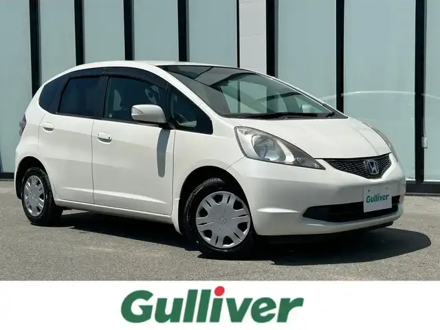 ホンダ フィット L 大阪府 2010(平22)年 8.5万km プレミアムホワイトパール 純正ナビ　/   TV/CD/DVD/Bluetooth/バックモニター/純正フロアマット/スマートキー/フルフラットシート/パワーウィンドウ/オートライト/ドアバイザー/ビルトインＥＴＣ/ダブルエアバック