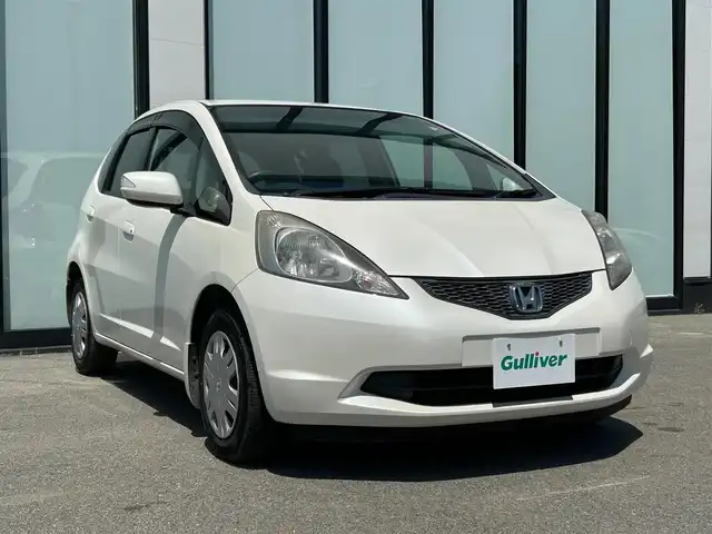 ホンダ フィット L 大阪府 2010(平22)年 8.5万km プレミアムホワイトパール 純正ナビ　/   TV/CD/DVD/Bluetooth/バックモニター/純正フロアマット/スマートキー/フルフラットシート/パワーウィンドウ/オートライト/ドアバイザー/ビルトインＥＴＣ/ダブルエアバック