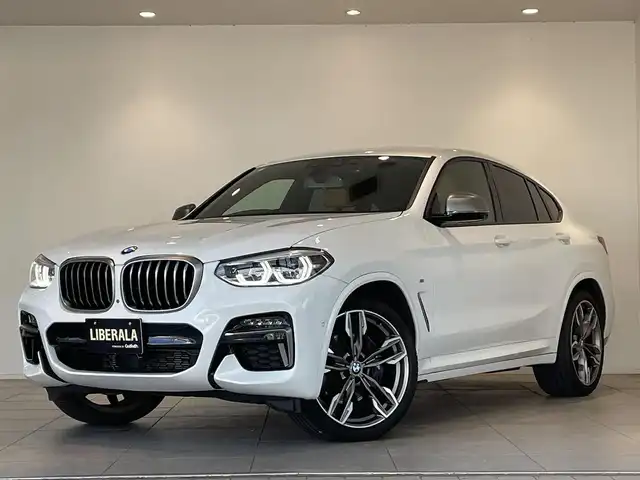ＢＭＷ Ｘ４ M40i 愛知県 2020(令2)年 6.6万km 白 コニャックレザー　/ＨＵＤ　/純正ナビ　/Ｂｌｕｅｔｏｏｔｈ　/フルセグＴＶ　/３６０度カメラ　/ＡＣＣ　/ＬＫＡ　/ＢＳＭ　/シートヒーター　/ワイヤレスチャージ　/ドライブレコーダー　/ミラー型ＥＴＣ　/インテリジェントセーフティ/ミラーリンク/パワーバックドア/プッシュスタート/ウィンカーミラー/アイドリングストップ