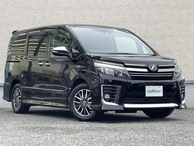 トヨタ ヴォクシー ZS 煌Ⅱ 大阪府 2016(平28)年 12.4万km ブラック 純正SDナビ(NSZT-Y66T)/BT/CD/USB/SD/TV/バックカメラ/ドライブレコーダー/両側パワースライドドア/レーンキープアシスト/純正フロアマット/純正16インチAW/LEDヘッドライト/フロントフォグ/オートハイビーム/電格ミラー/スペアキー/ETC