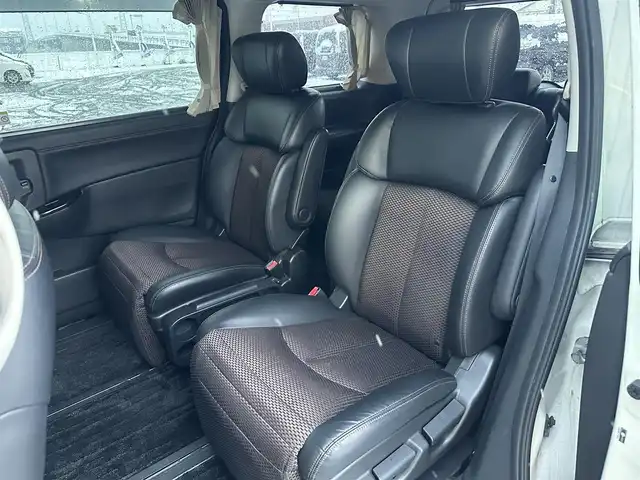 日産 エルグランド 250ハイウェイスター 道北・旭川 2013(平25)年 12.5万km ブリリアントホワイトパール (株)IDOMが運営する【じしゃロン旭川店】の自社ローン専用車両になります。こちらは現金またはオートローンご利用時の価格です。自社ローンご希望の方は別途その旨お申付け下さい/　/・社外ナビ(CD/DVD/BT/HDD/SD/フルセグ)/・バックカメラ/・ETC/・両側パワースライドドア/・フリップダウンモニター/・電動格納ウィンカーミラー/・プッシュスタート/・スマートキー2個/・フォグランプ/・オートライト/・現車装着サマータイヤ 純正AW225/55R18/・取扱説明書